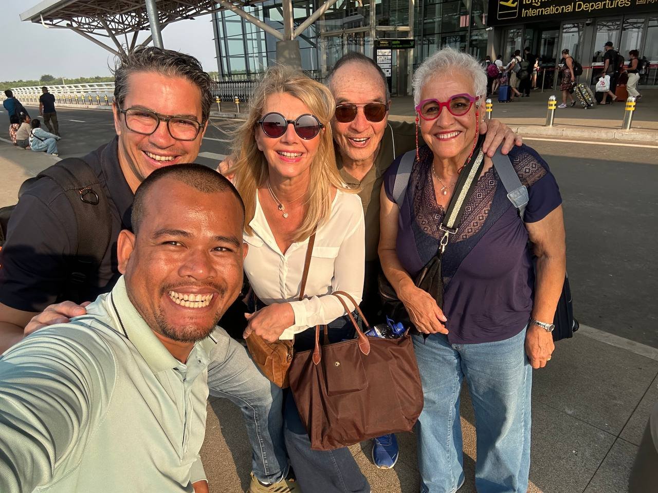 Guests with driver at airport